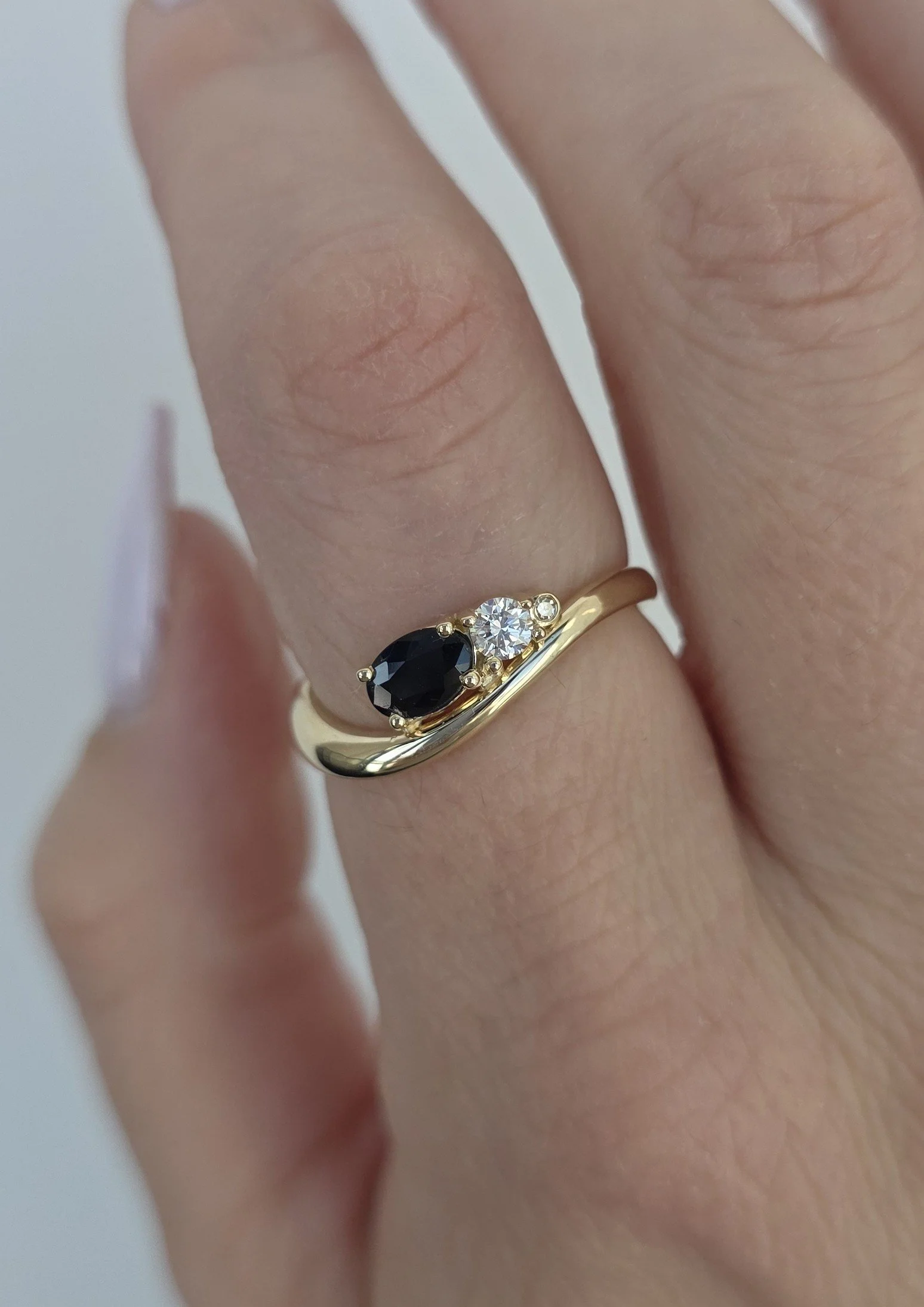 Custom redesign ring project in yellow gold using heirloom blue sapphires and diamonds