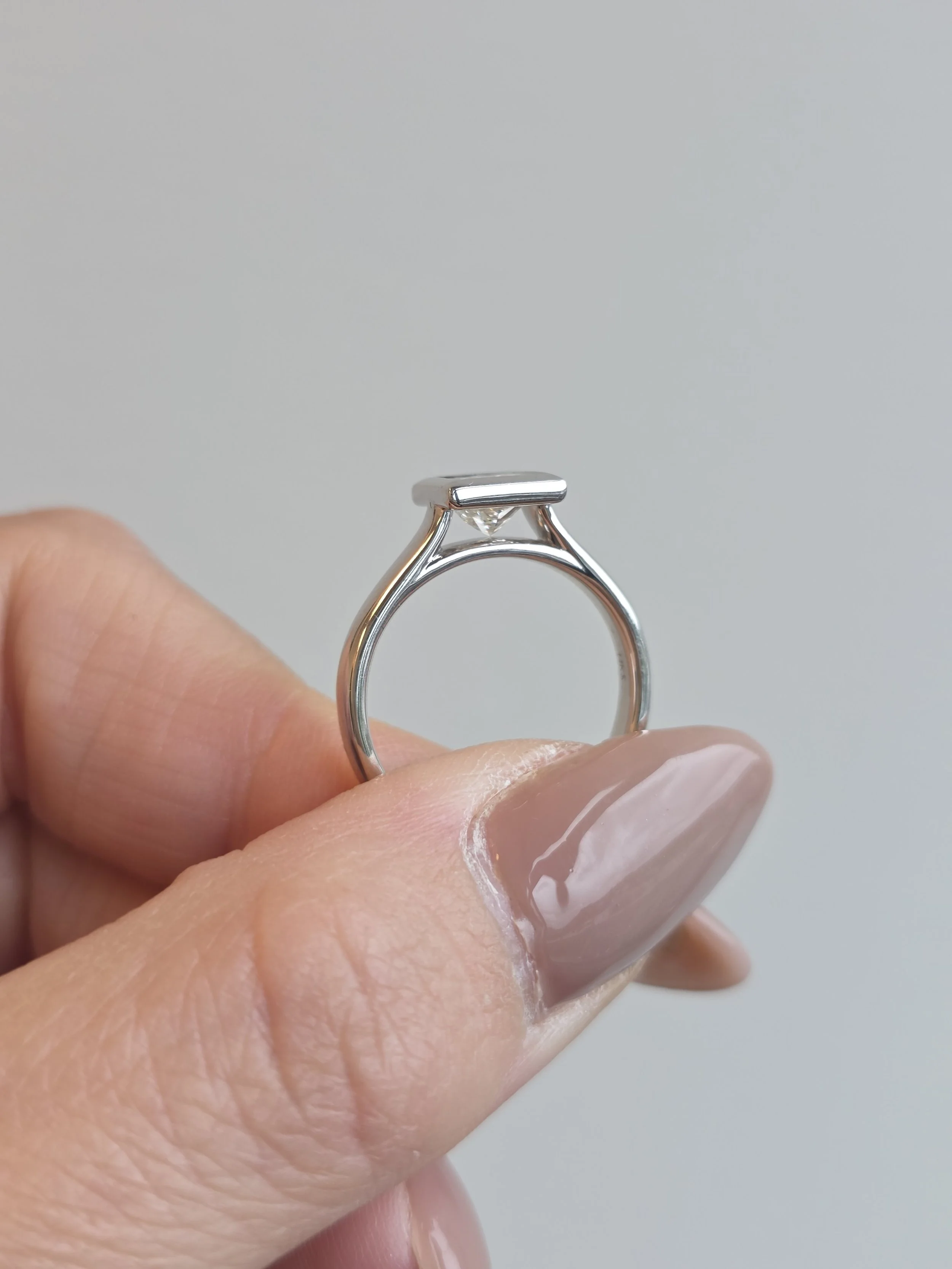 Princess cut bezel set engagement ring
[engagement]
[redesign]