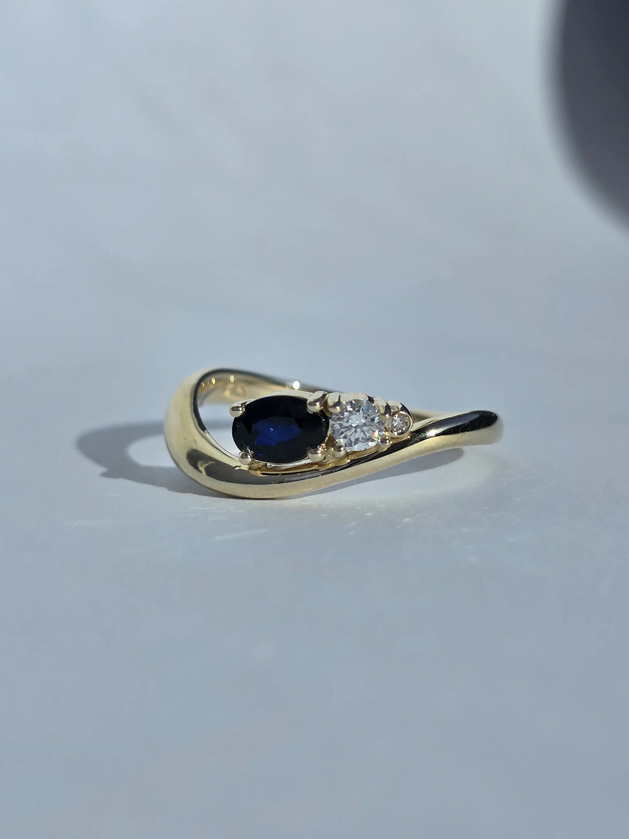 Blue sapphire and diamond wave ring using client's existing pieces and stones
[redesign]
[gemstone]