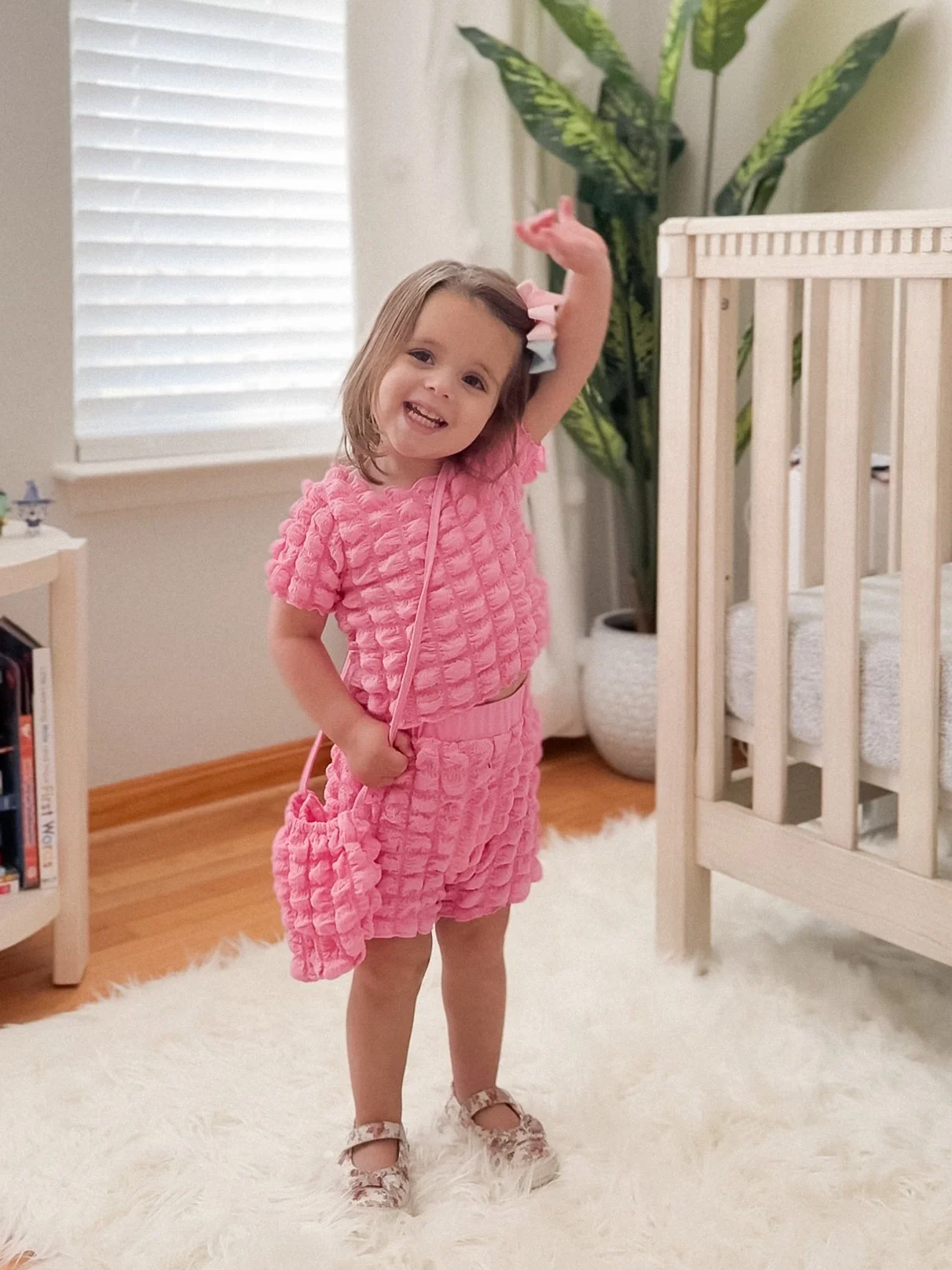 Toddler in pink bubble set
