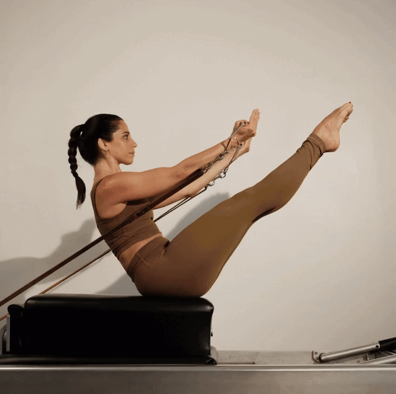 A slideshow of images of women and men using Pilates equipment in the Opus space.