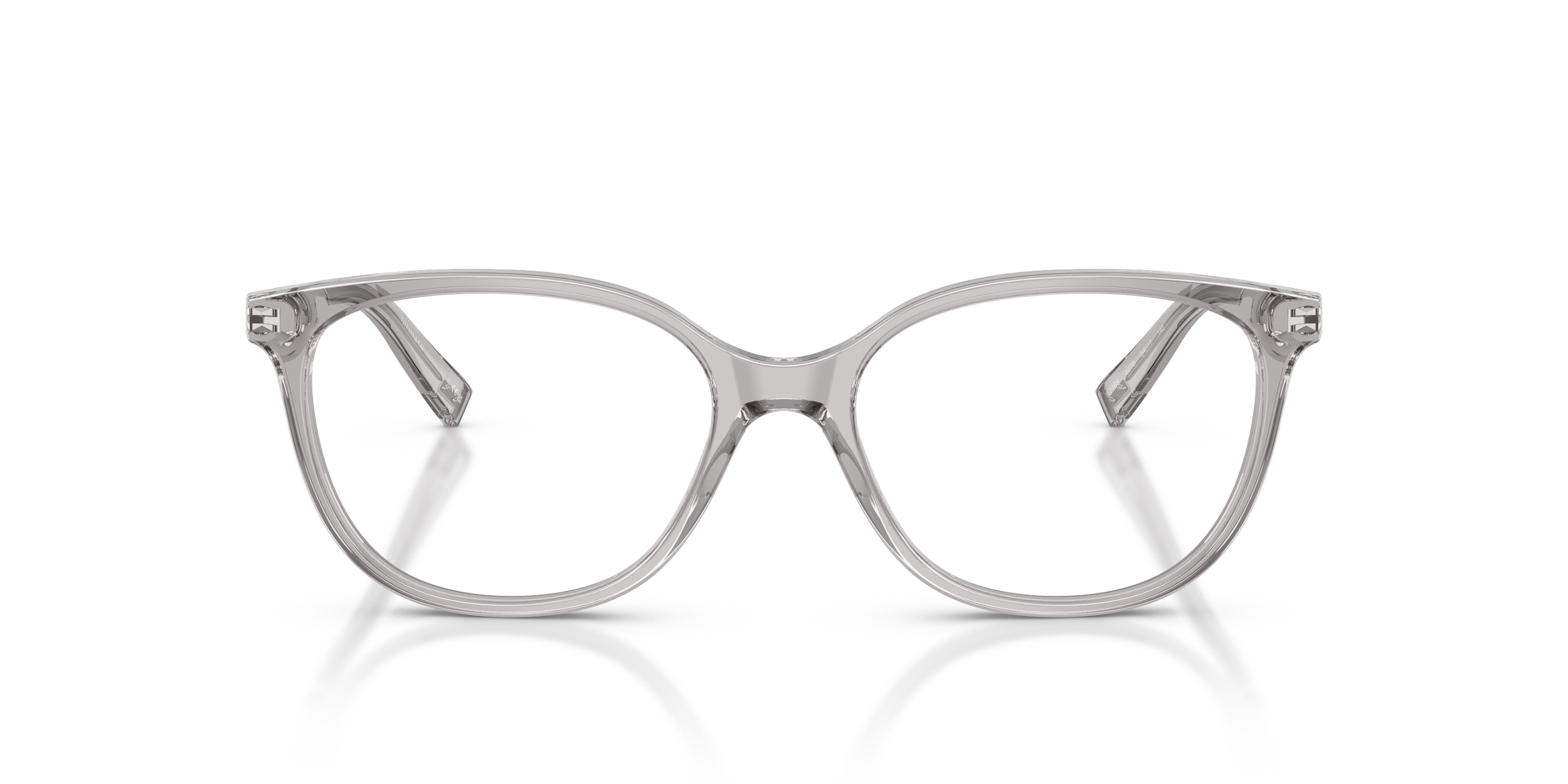 Clear plastic Tiffany designer eyeglasses with a silver bridge and arms, reflecting on a white surface.