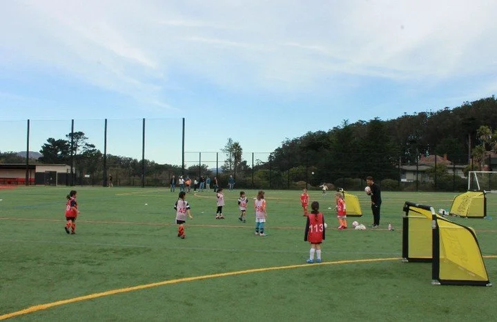 4v4, 4 goal game. 
Thrilling. Perfect for working on attacking shape and space, whilst also teaching defenders to stay together and force play. So many coaching opportunities. So many goal scoring opportunities. So much fun!