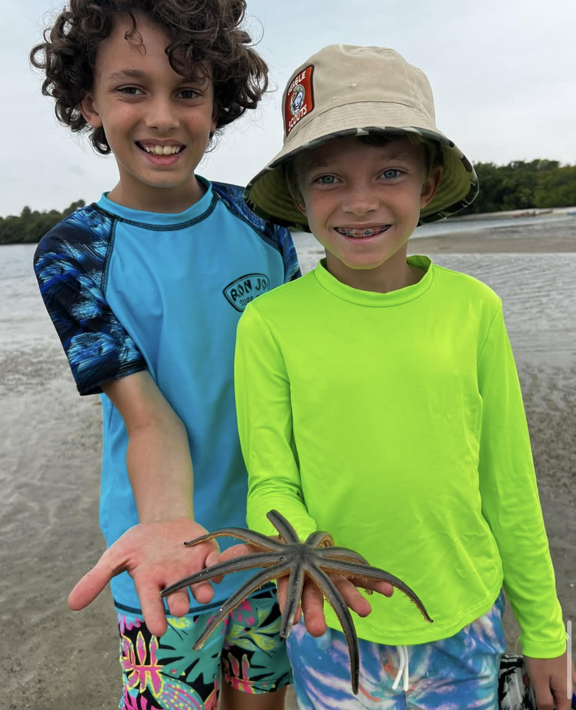Whitehorn boys at Munion Island in FL. The younger boy is holding a starfish.
