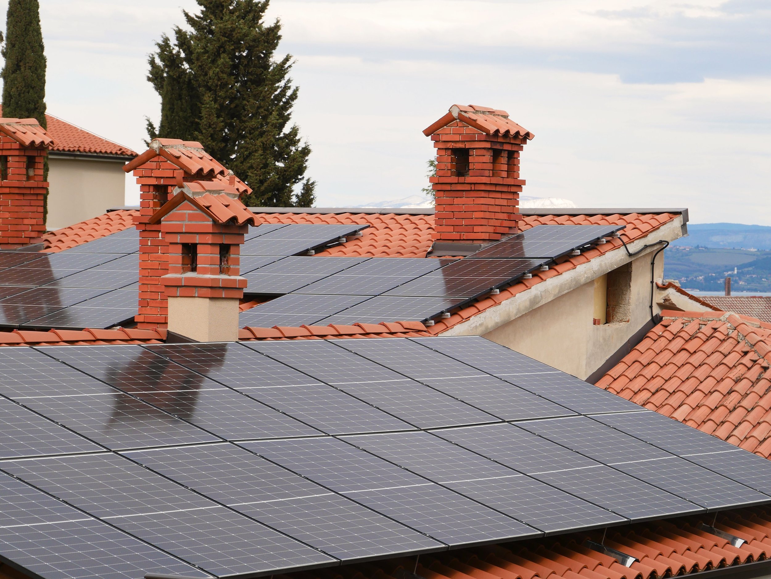 Solar panels fixed on top of a terracotta roof