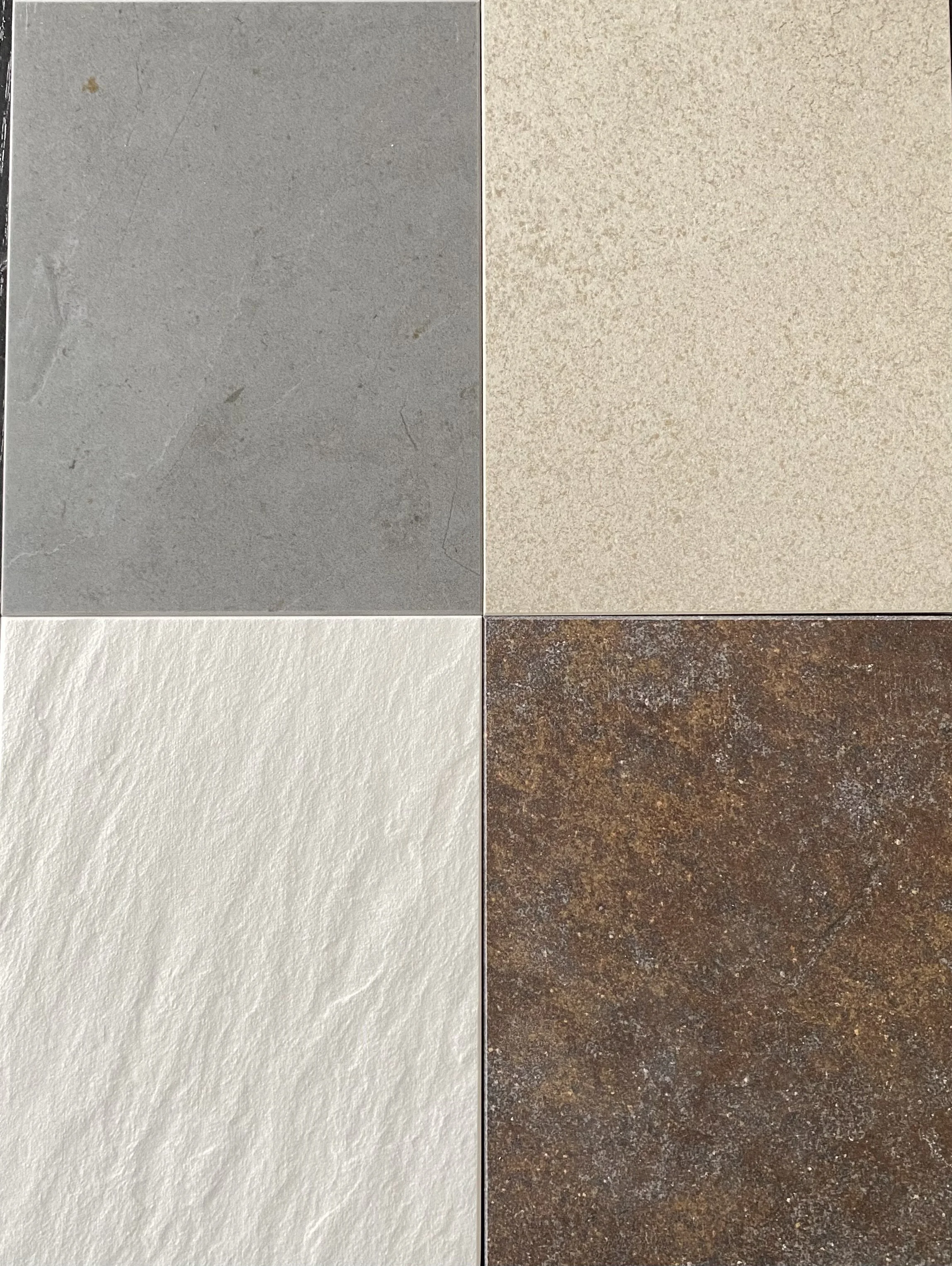A collage of four different tiles: gray, beige, white, and rust-colored.