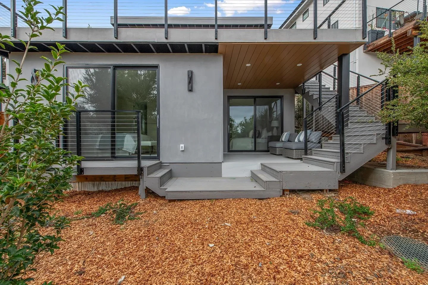 Backyard porch and patio by Three Pillars Construction.webp