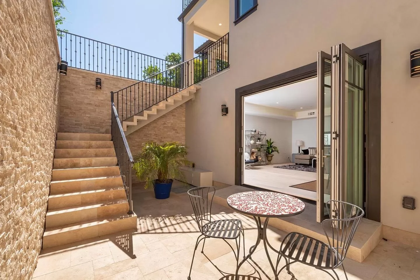 Beautiful bright lightwell with patio by Three Pillars Construction.webp