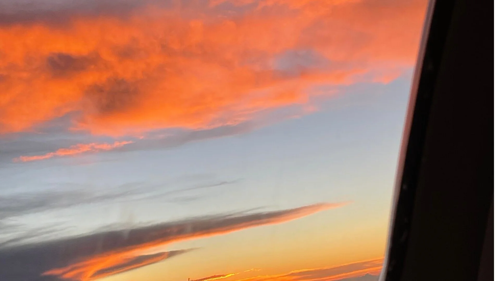 Sunset from airplane window – Lamour World Travels