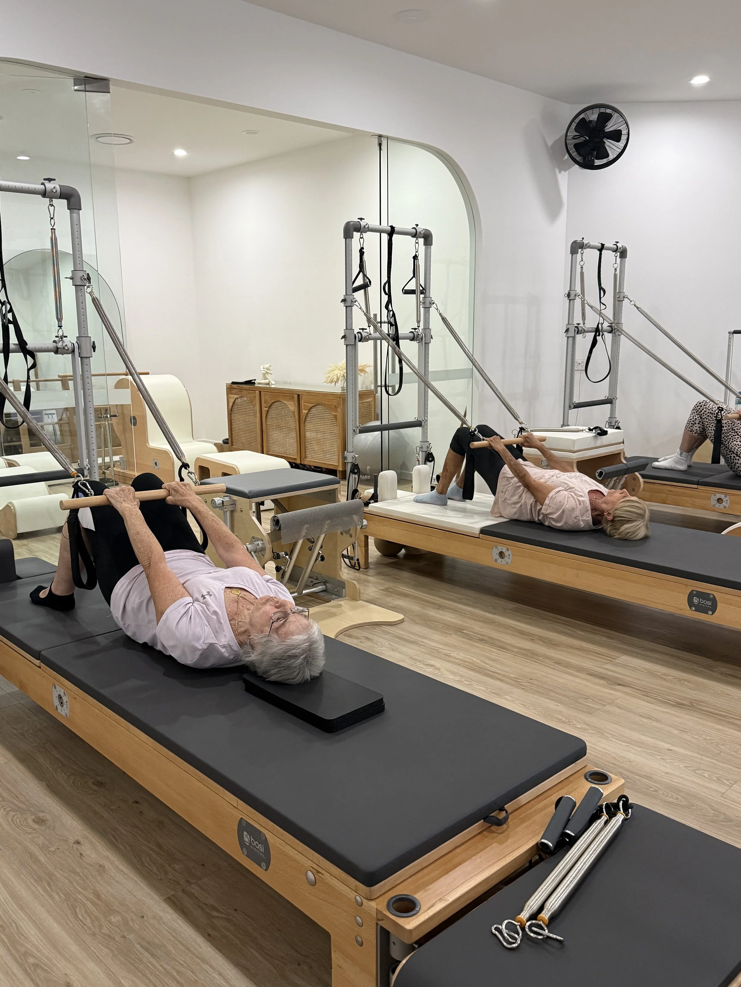 Living Well Class on the tower - adding support to our work.  When we can't achieve something on once piece of apparatus, we can try on another. - the way the Pilates Method was intended.