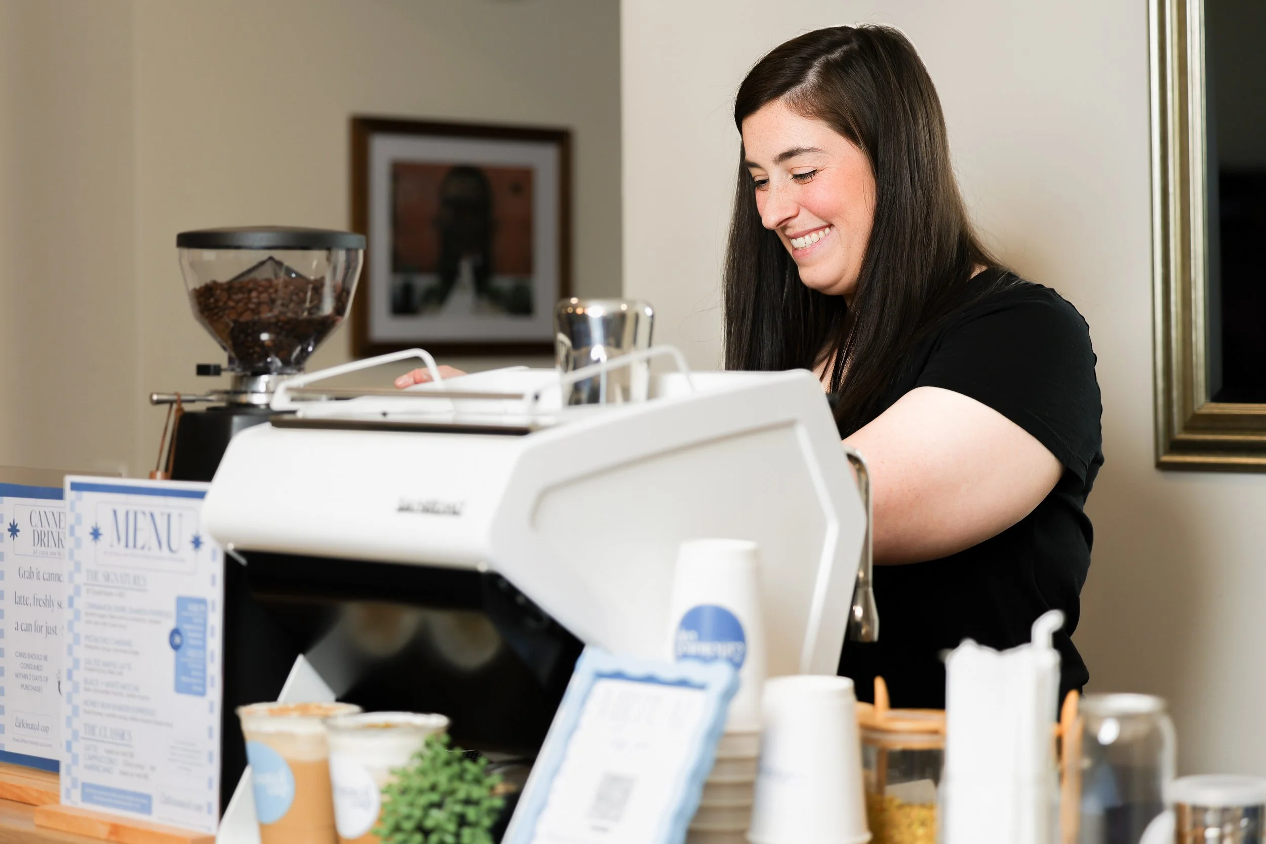 The owner of the Caffeinated Cup brewing a fresh shot of espresso for a custom drink in South Jersey.