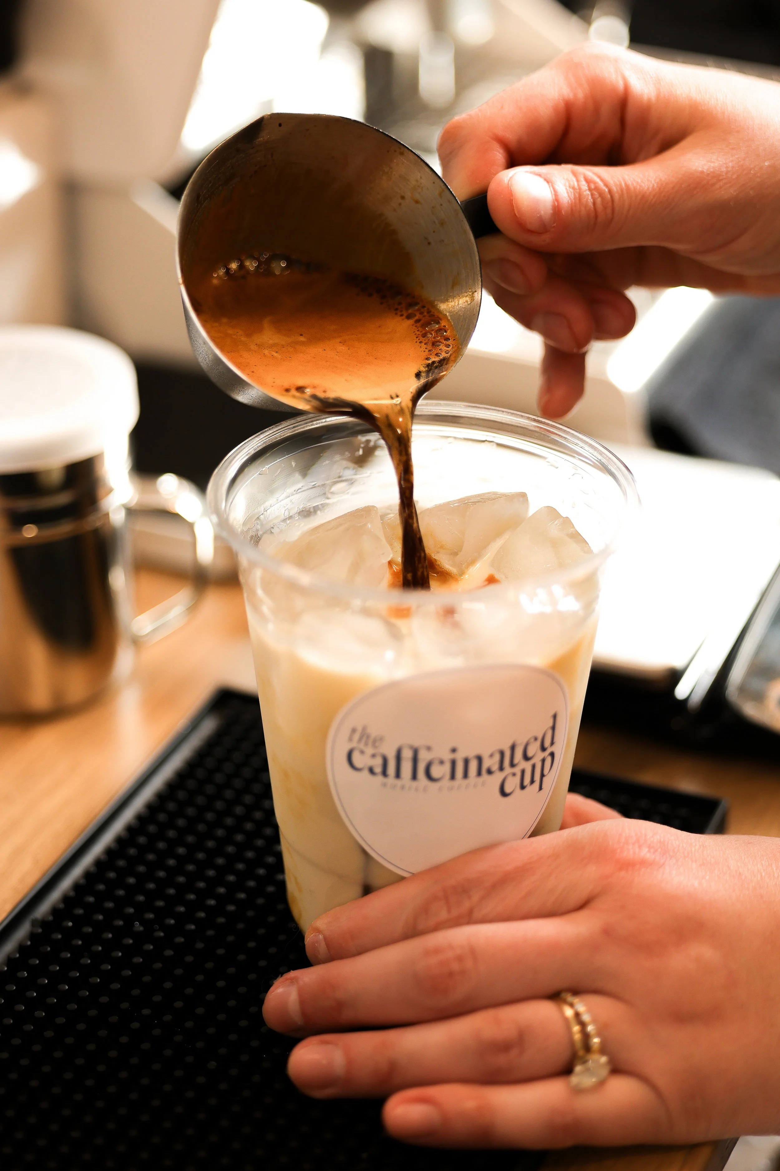 Espresso pouring into custom cup in south jersey.
