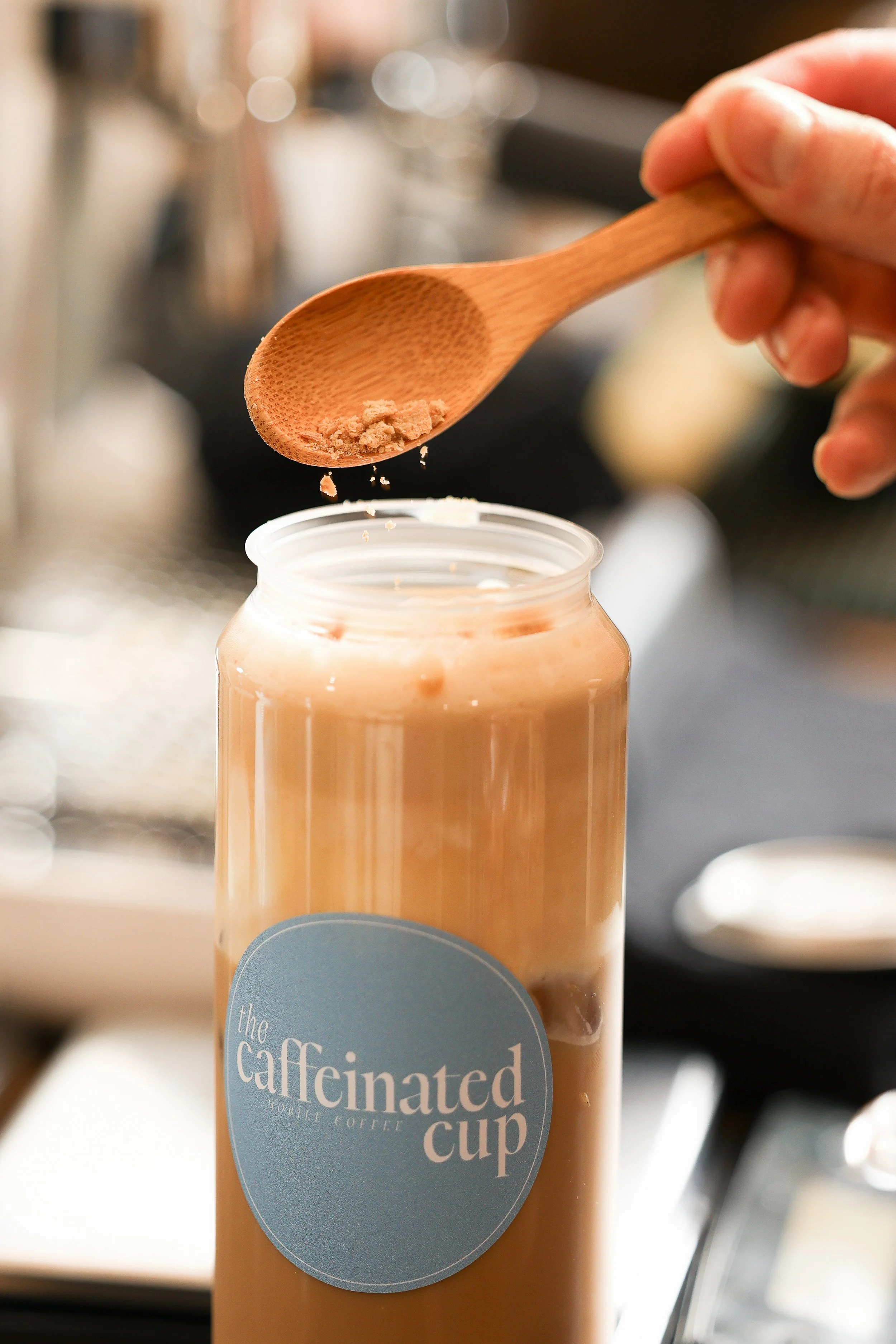 Finishing touches on a can of  premium espresso drinks at a catered celebration — The Caffeinated Cup brings a personalized coffee experience to every South Jersey event