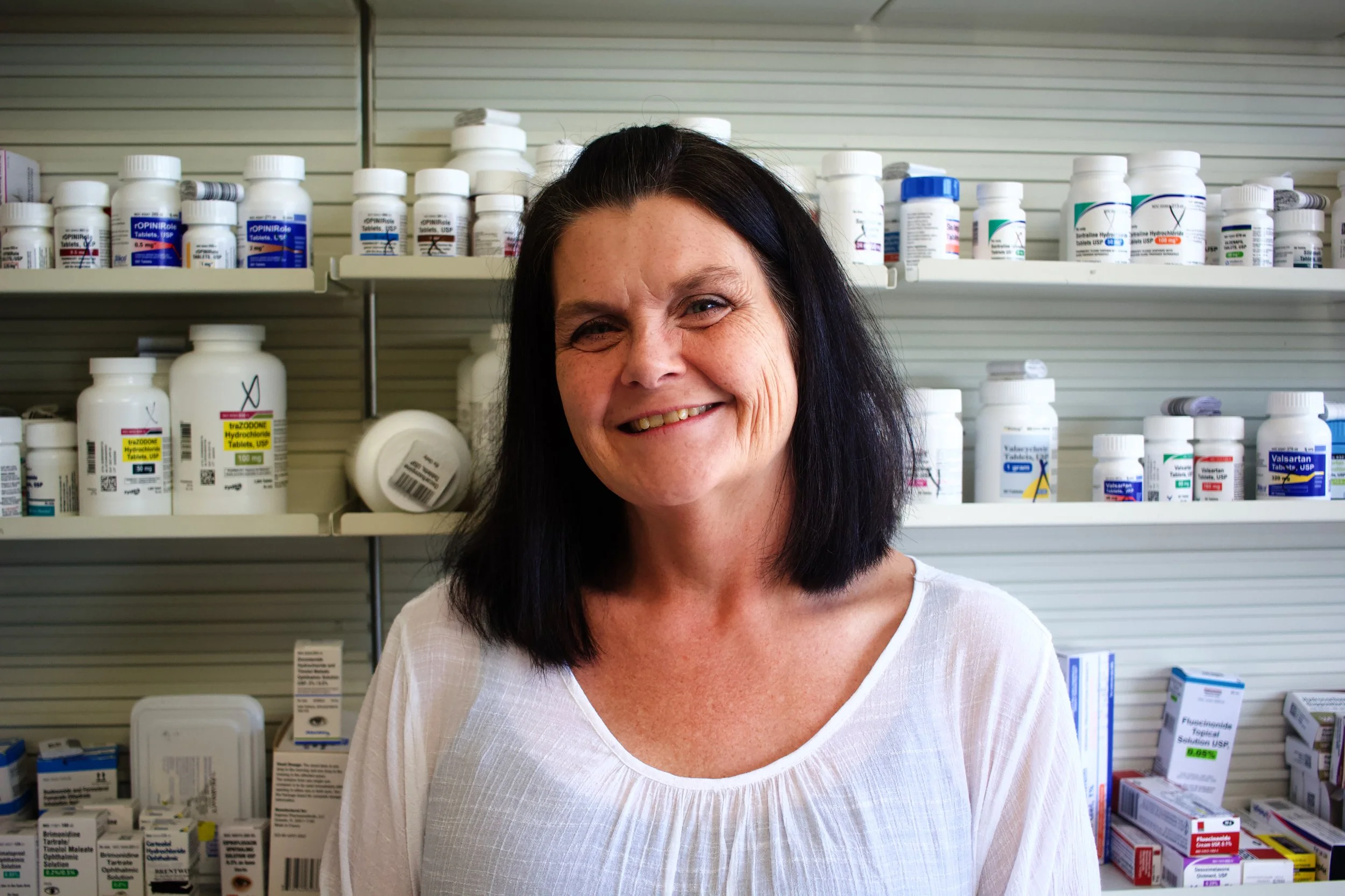 Black-and-white close-up of a single human eye with visible eyelashes and reflective surface.
