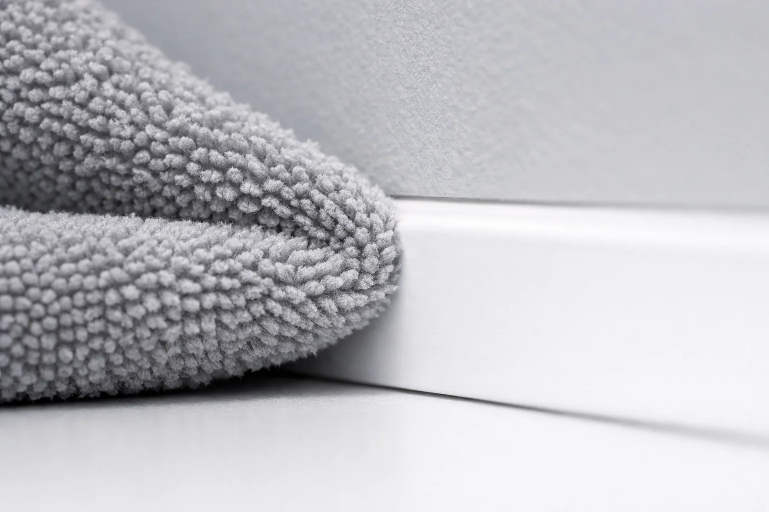 Detail-oriented commercial deep cleaning service showing white-glove attention to baseboards and high-end office finishes.