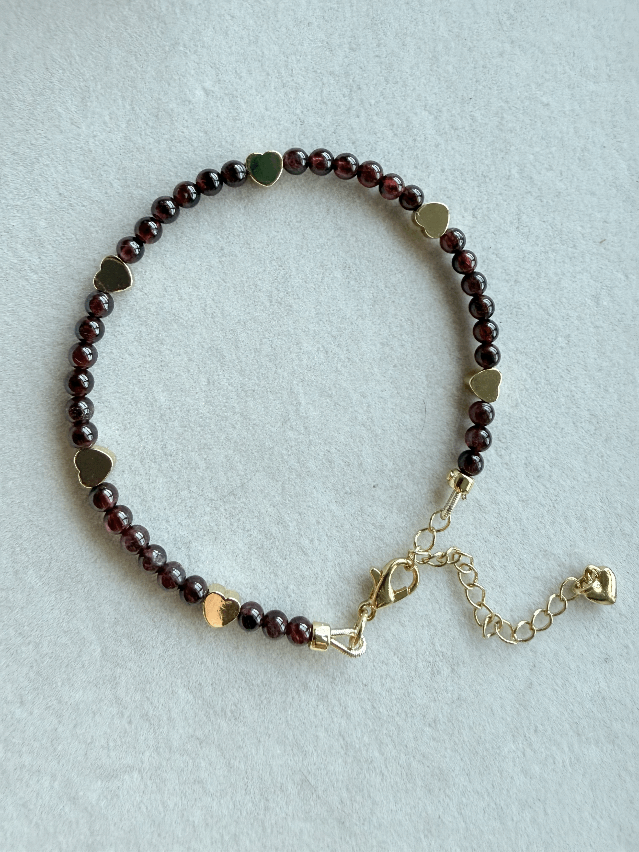 Elegant Garnet & Gold Heart Bracelet