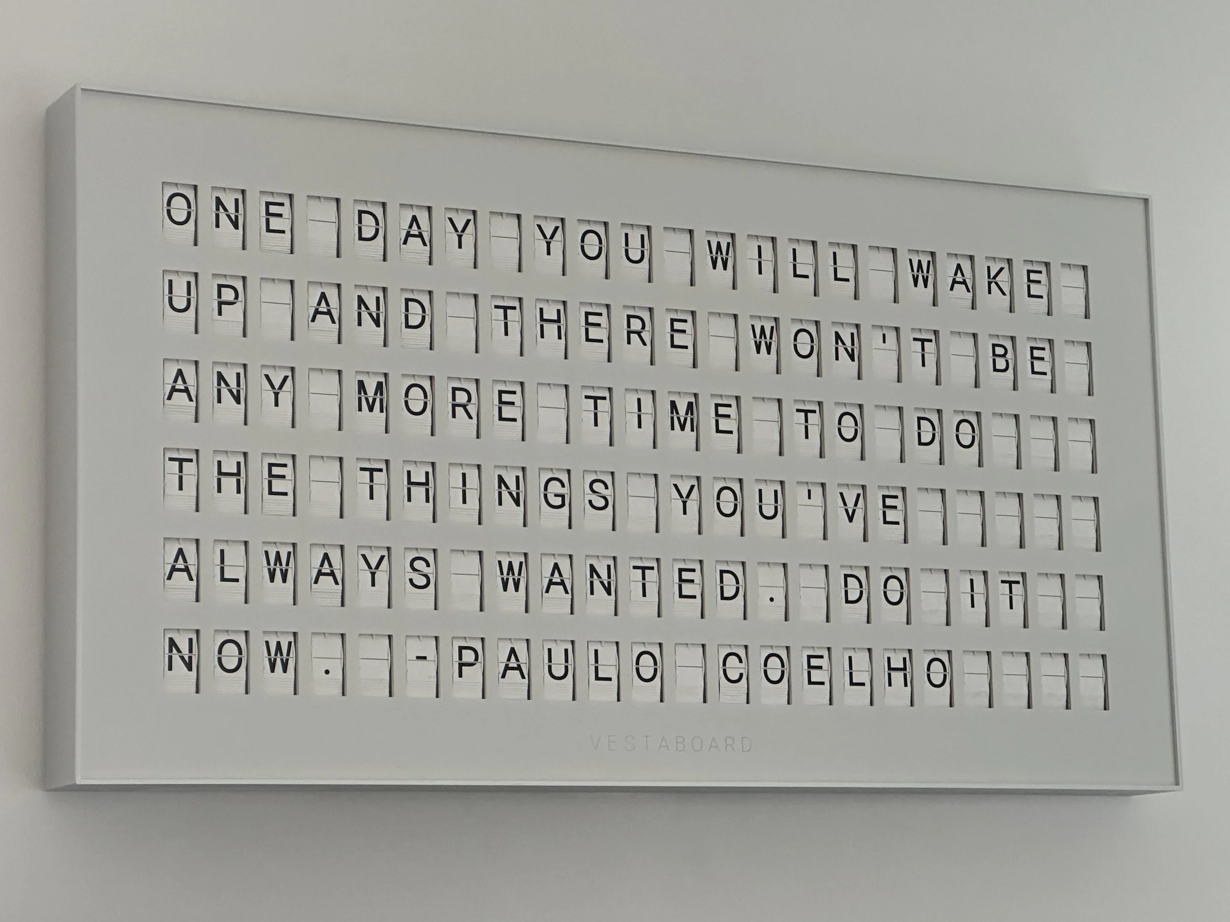 White message board with a quote from Paul Coelho in black letters on a white background
