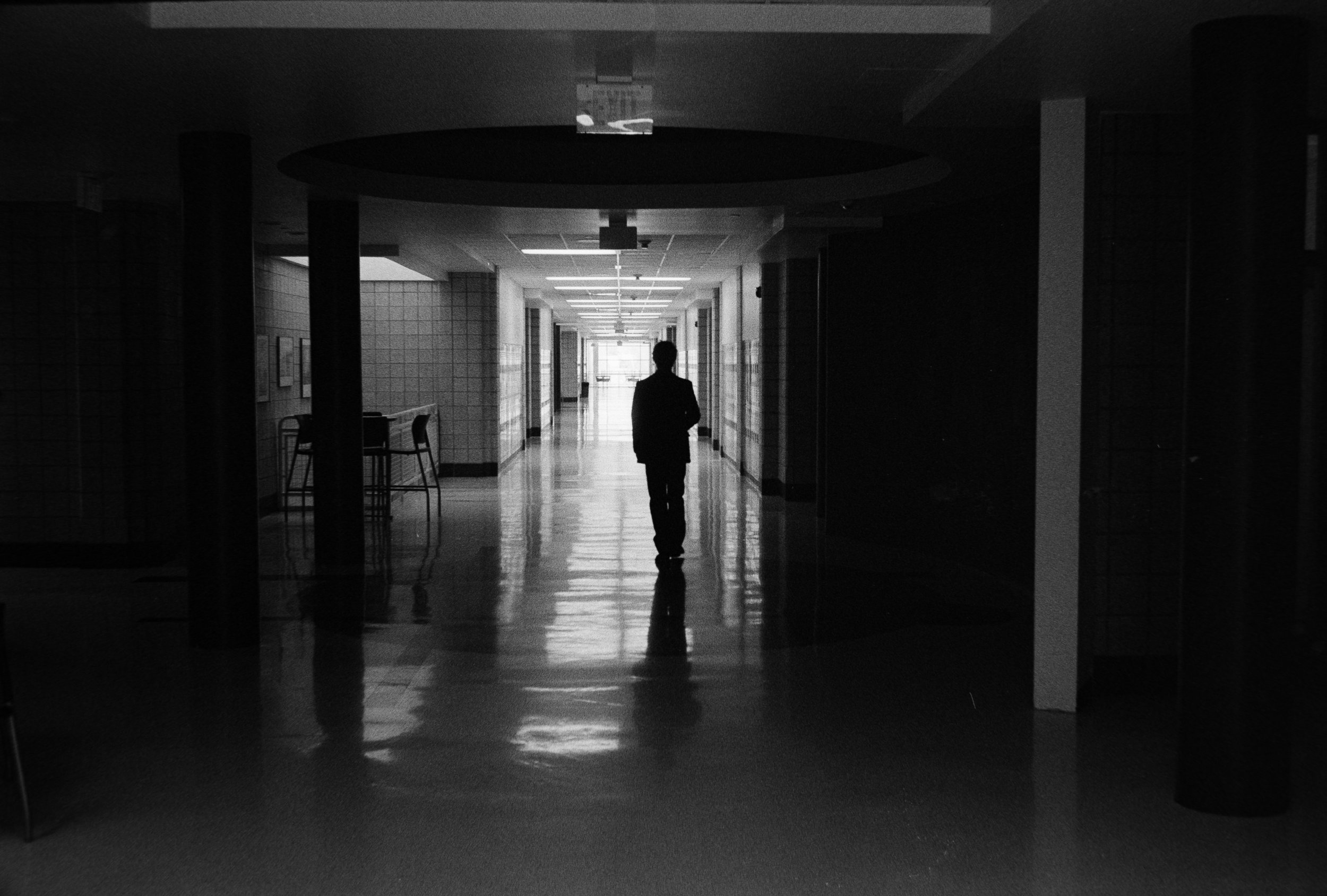 Teenager alone in hallway