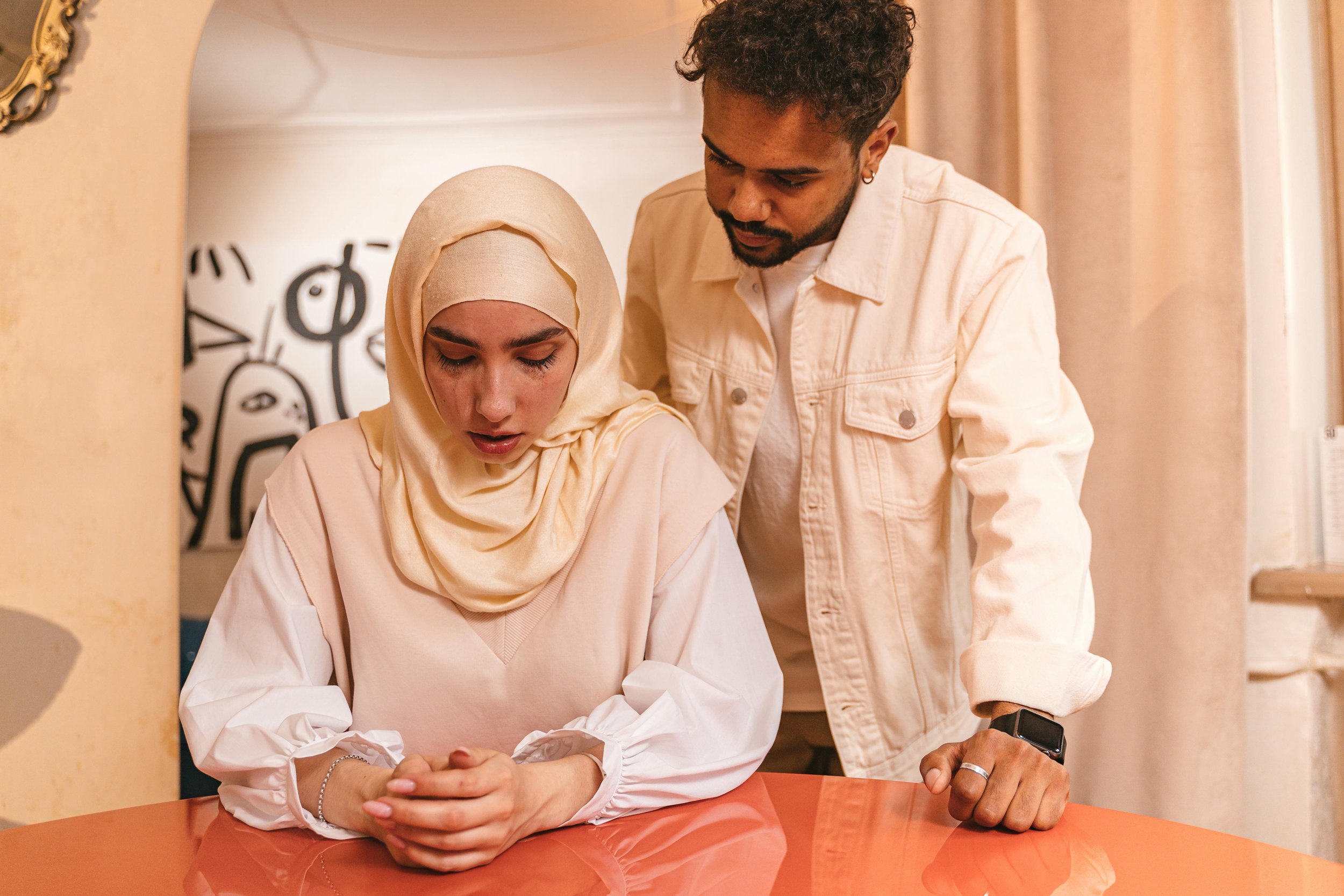 Muslim muslim crying and husband looking at her
