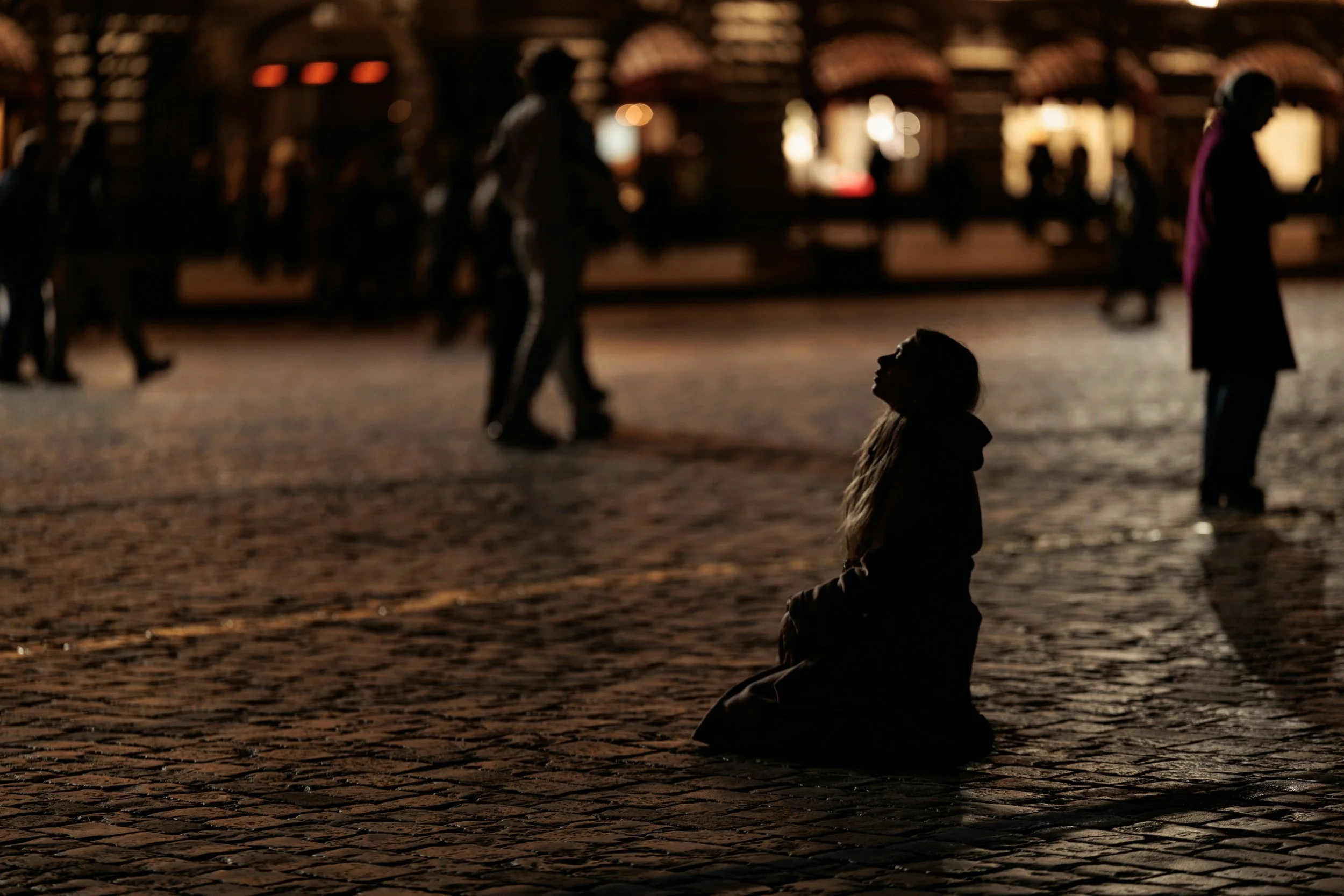 Muslim person standing alone in a public space