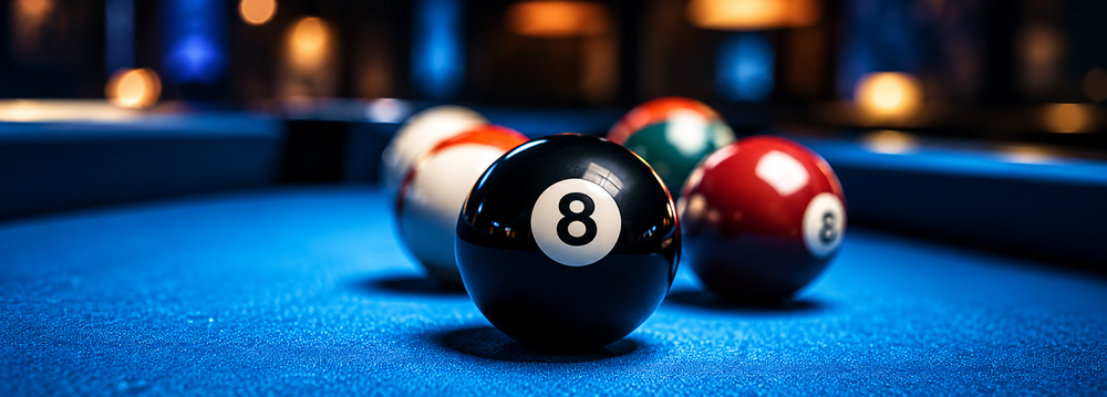 Billiard balls with the 8-ball on blue tournament felt