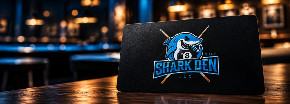 The Shark Den membership card with the shark logo
