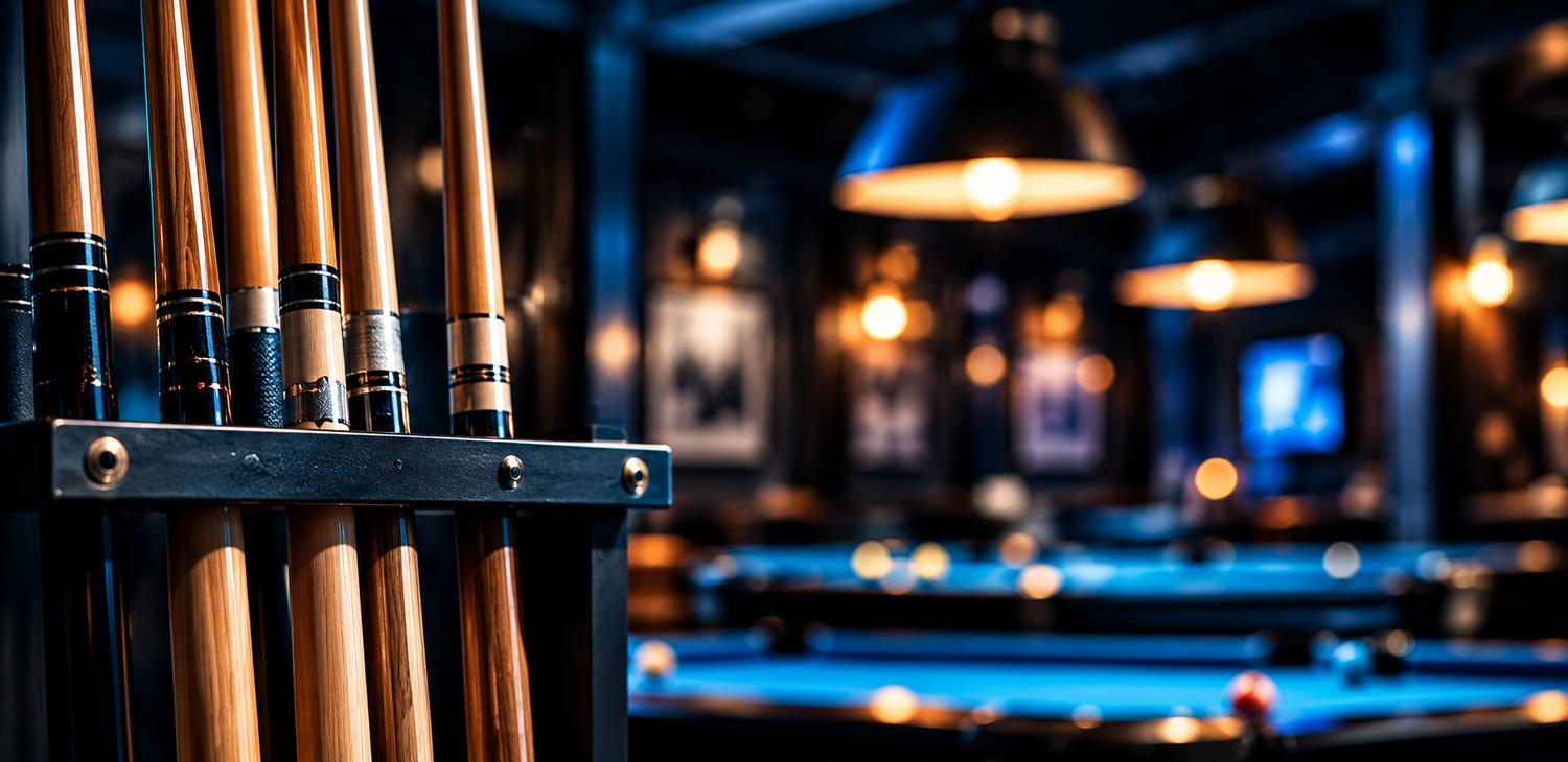 Pool cues in a rack beside the 8-ball on blue felt