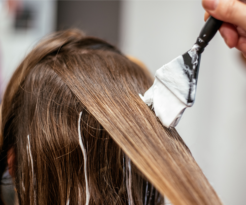 Close-up of freshly colored hair showing rich, dimensional brown tones after a salon coloring appointment.