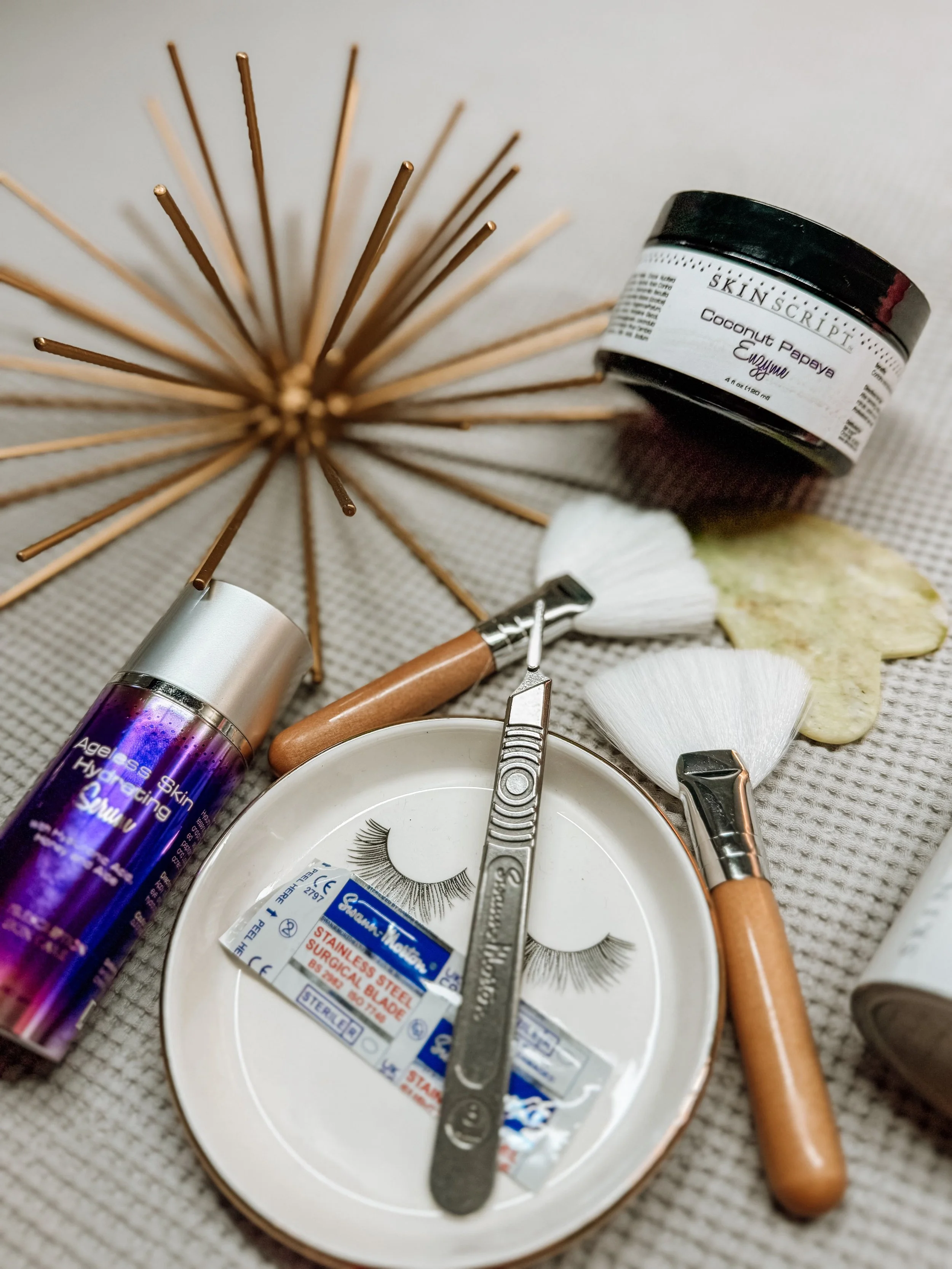 Professional esthetician tools arranged for a facial skincare treatment.
