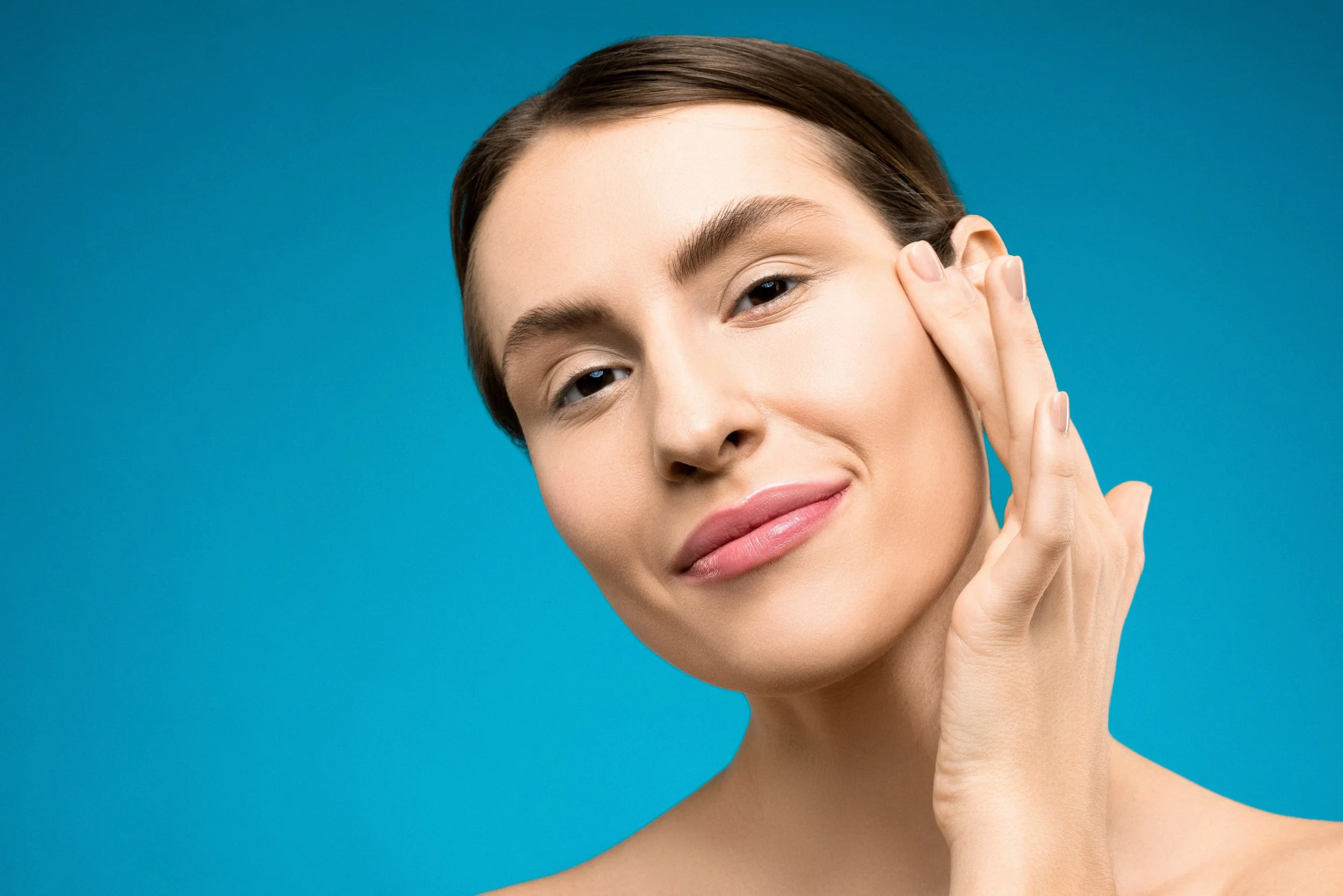 Close-up of smooth, glowing skin after a professional dermaplaning treatment.