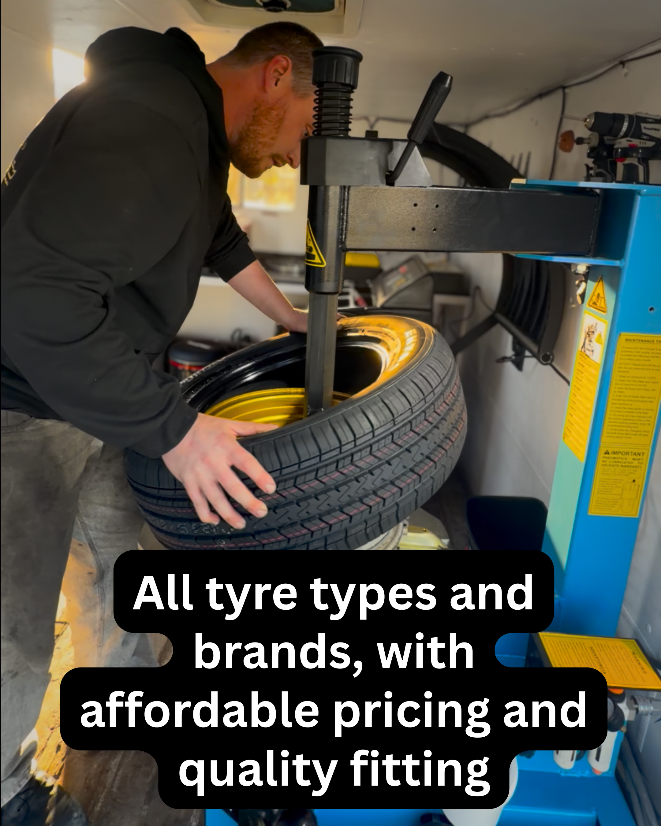 a man changing a tyre, in a mobile tyre shop in Napier and hastings