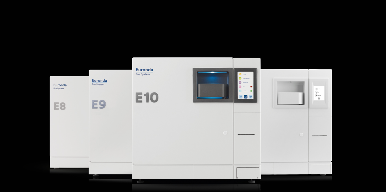 A row of medical equipment machines with labels E8, E9, and E10, used for laboratory or medical diagnostics, set against a black background.