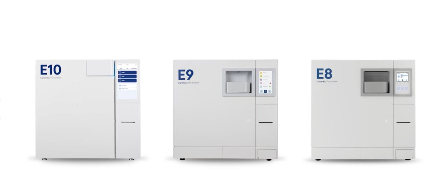 Three medical laboratory analyzers labeled E10, E9, and E8 from Eurofins Pro System, arranged side by side, with digital displays and compartments for sample handling.