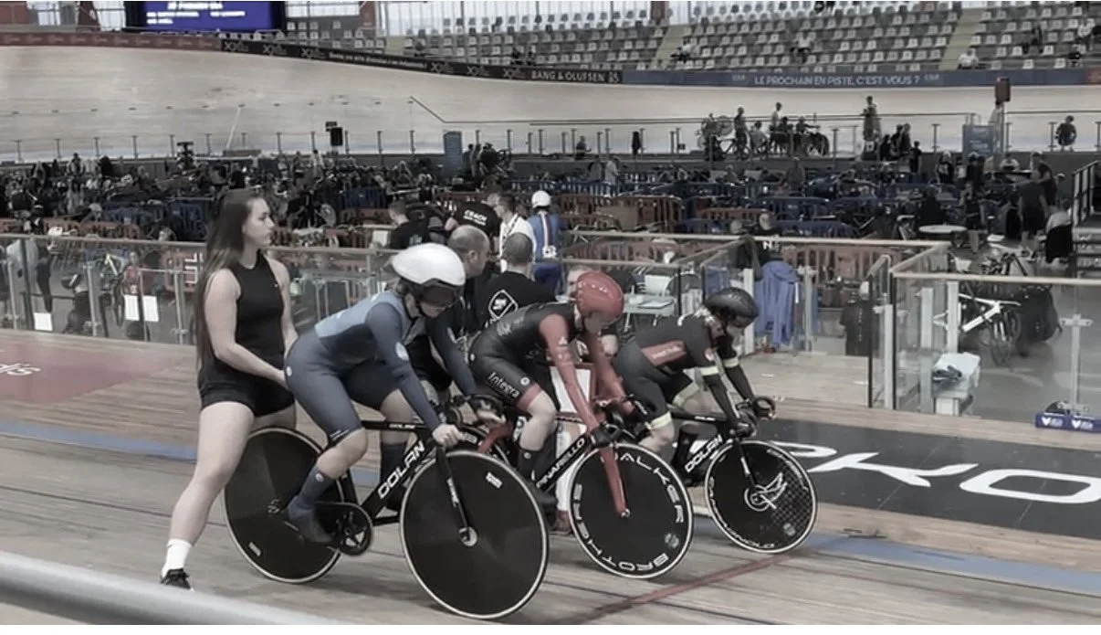 Female cyclists line up at the velodrome for World Championship race.