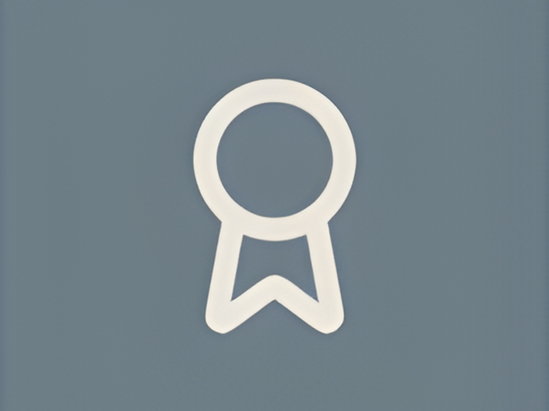 White award or recognition ribbon symbol on a gray background.