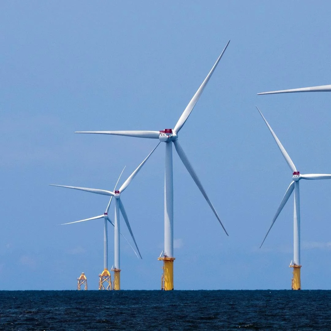 Offshore wind turbines in the ocean during daytime