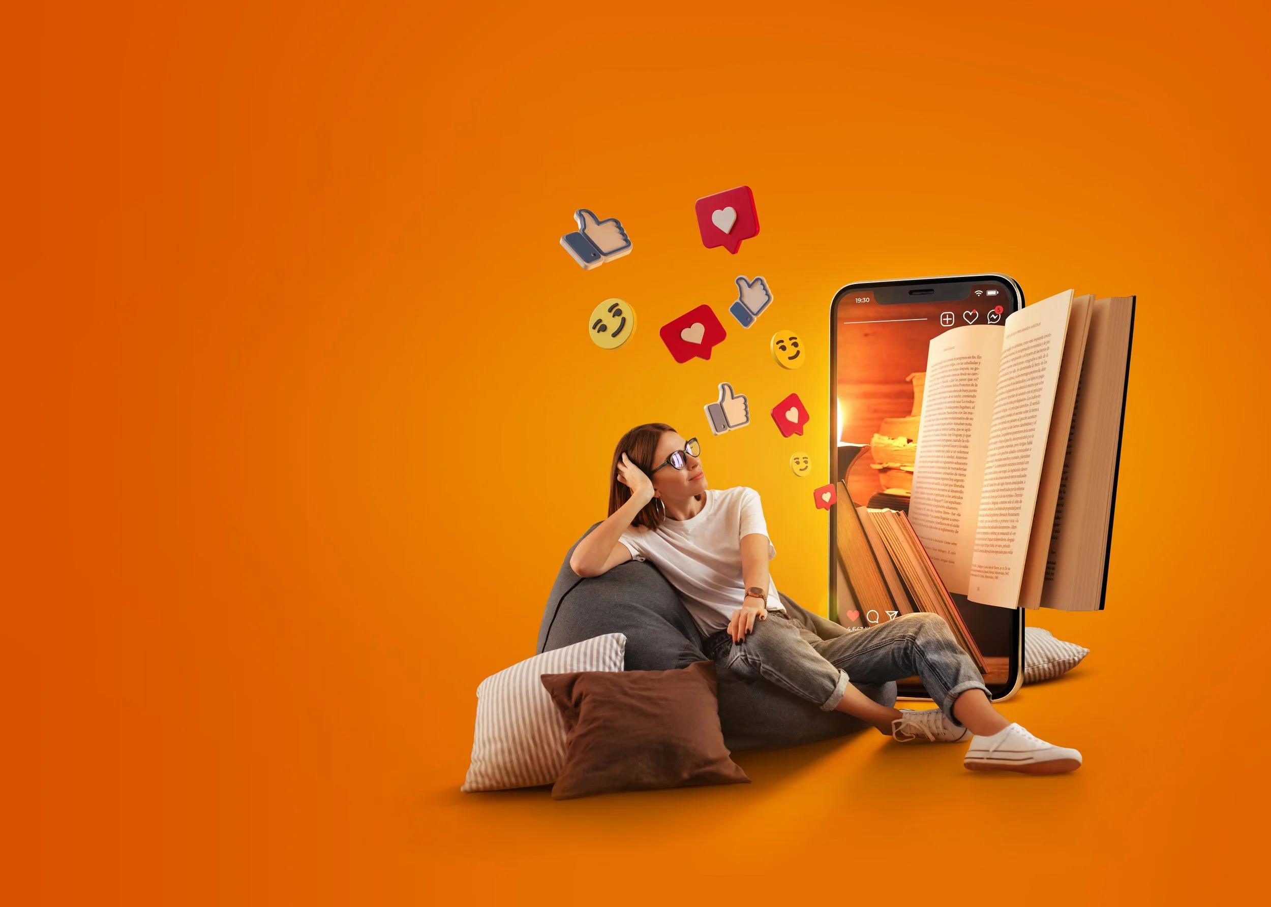 A woman sitting on pillows and in a bean bag while leaning on her hand, surrounded by floating digital icons of thumbs up, hearts, and smiling faces, with a large smartphone displaying an open book and sunset background.