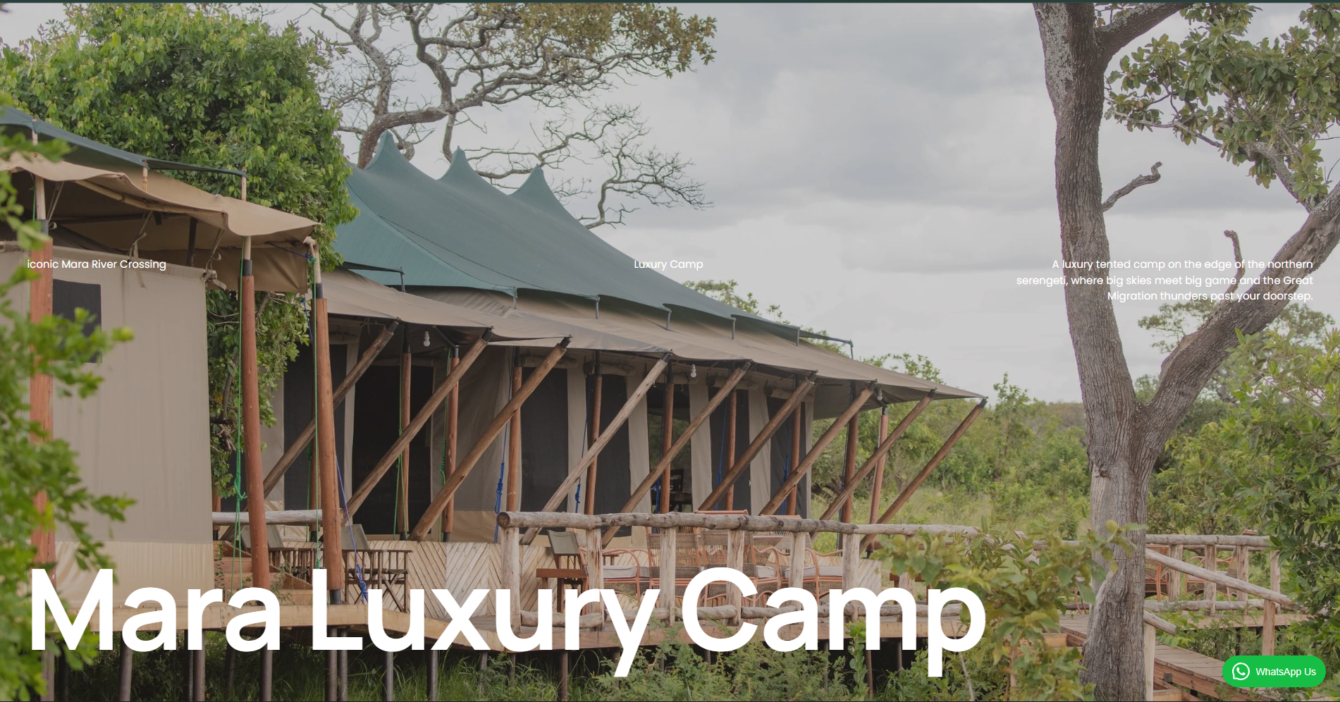 A luxury tented camp on the edge of the northern Serengeti with big skies, big game, and migration passing by, surrounded by trees and greenery.