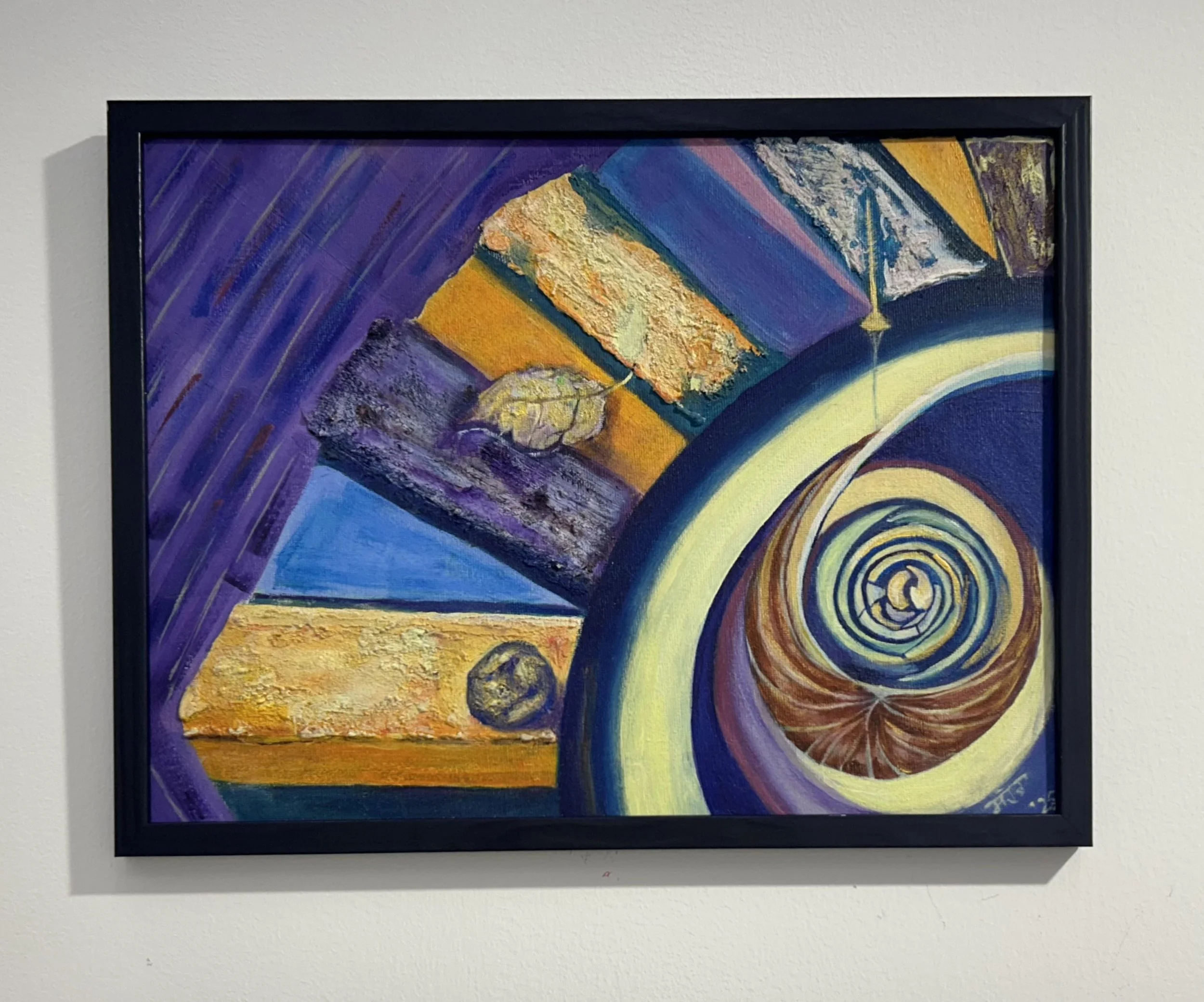 Close-up of an abstract painting with vibrant colors, swirling patterns, and textured brushstrokes, framed and hung on a white wall.