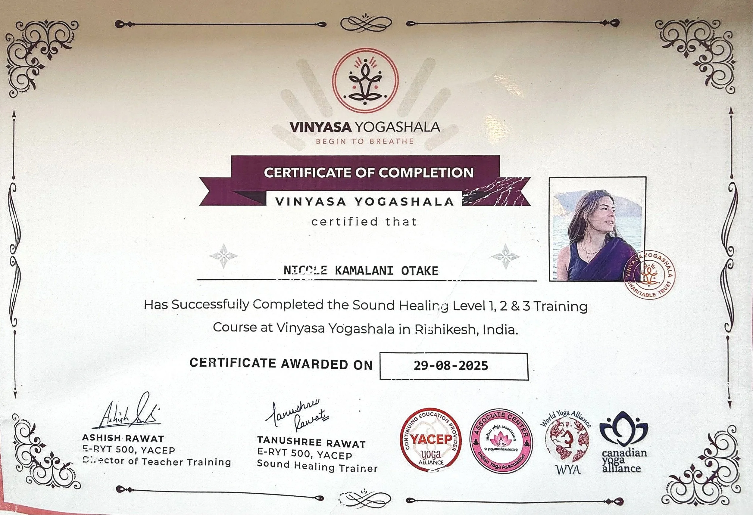 Certificate of completion from Vinyasa Yogashala awarded to Nicole Kamalani Otake for completing sound healing training in Rishikesh, India, dated 29-08-2025, with signatures and logos of related yoga organizations.