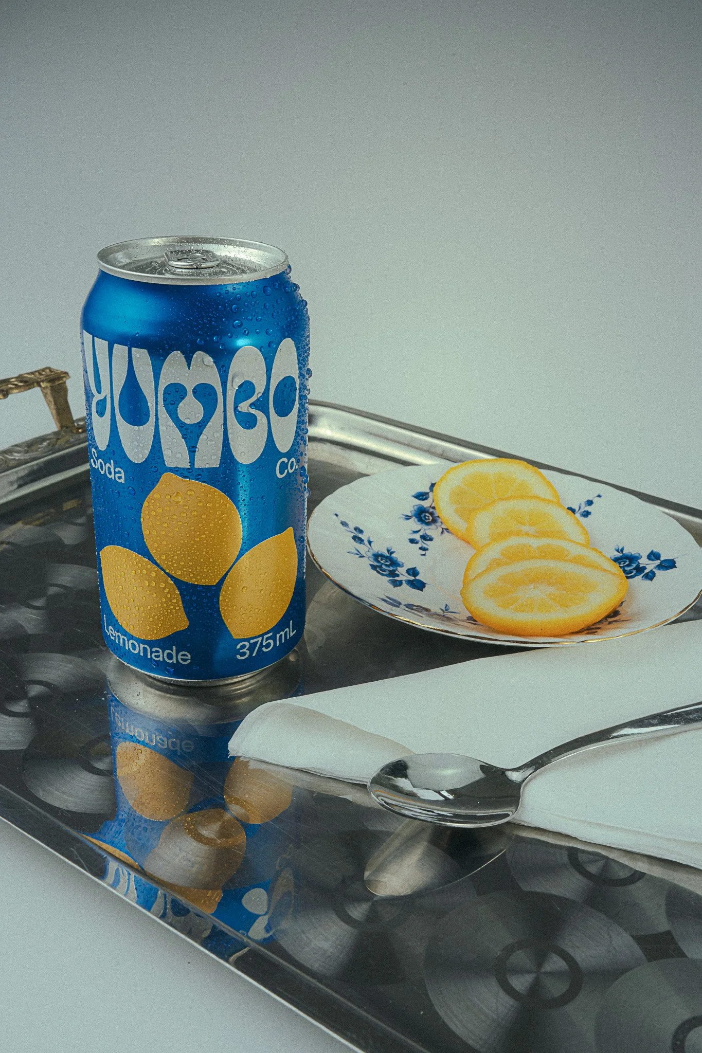 Yumbo soda can product photography – studio editorial with high-class props