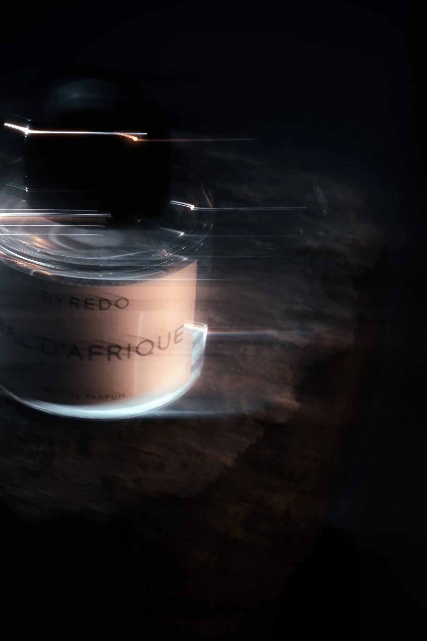Byredo perfume photographed on rocks – Slow shutter surreal editorial product photography