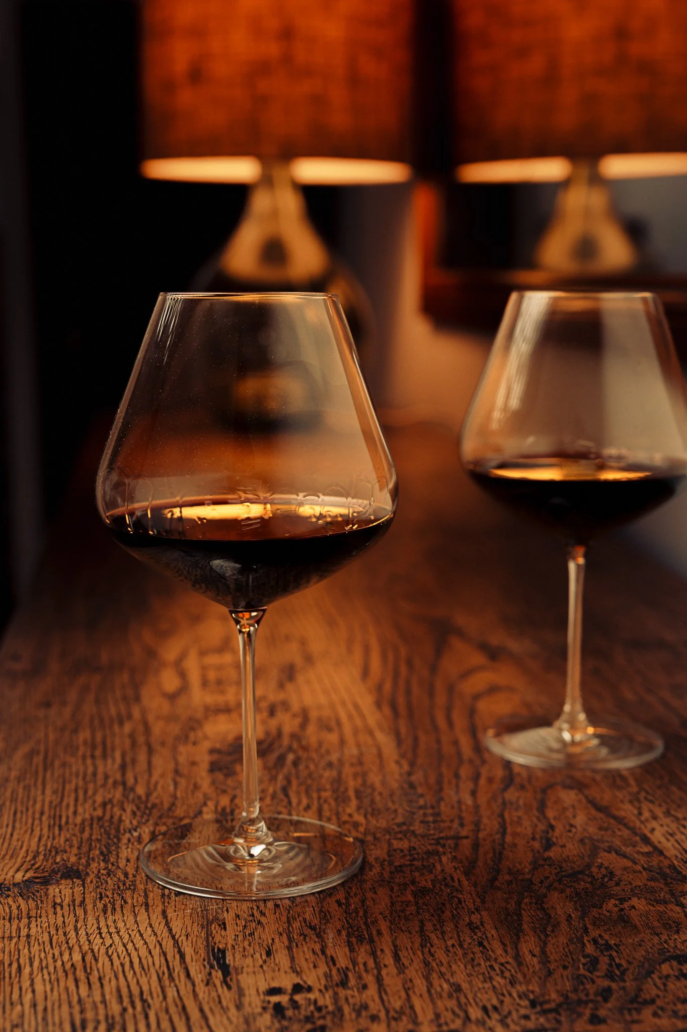 Plumm wine glass product photography – styled in lifestyle settings wooden table
