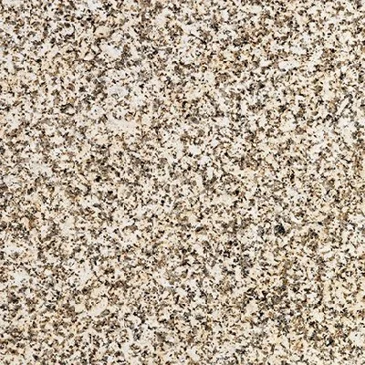 Surface en granit beige avec motifs sombres.