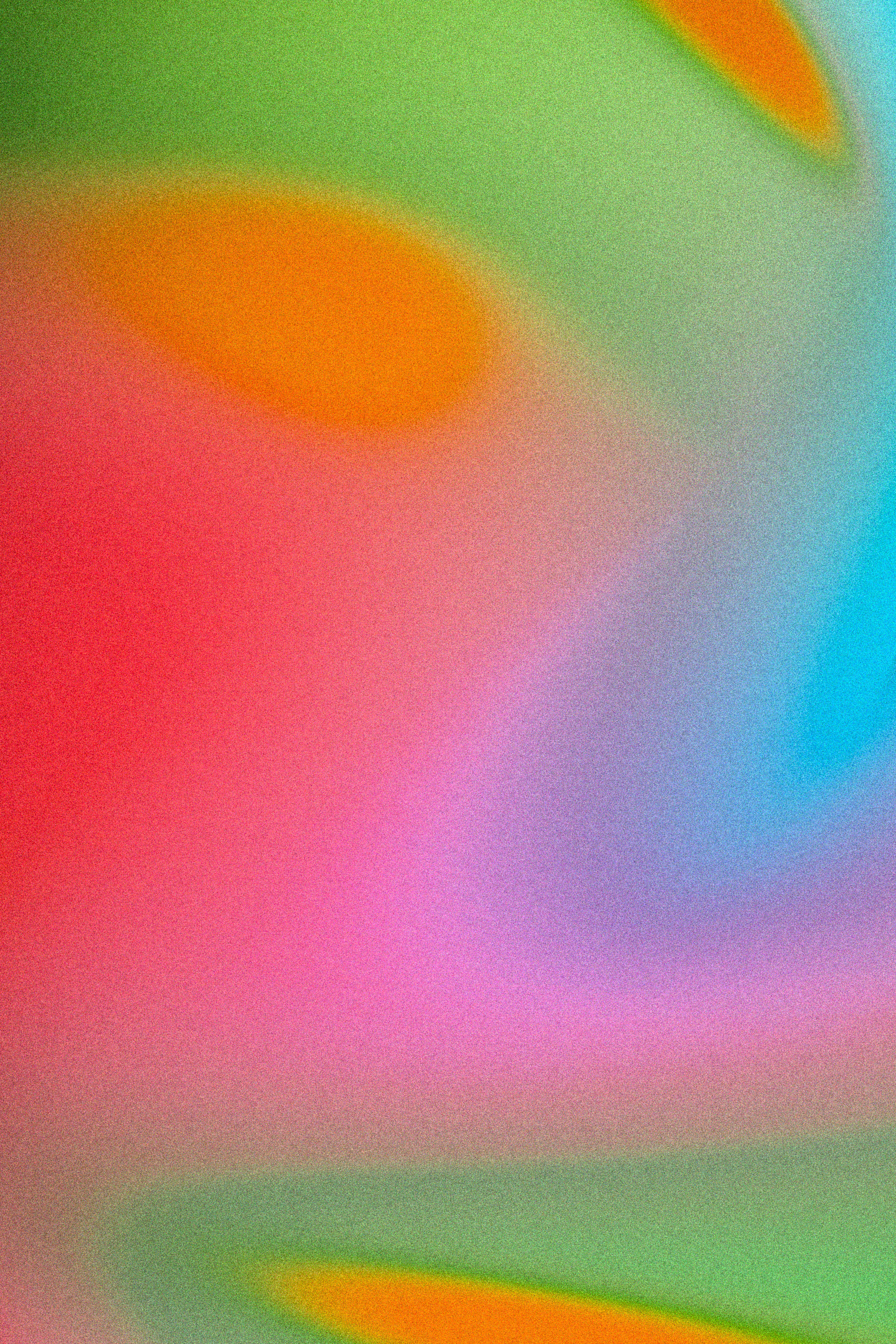 Värikäs, epäsymmetrinen abstract taustakuva, jossa on sävyjä kuten punainen, vihreä, oranssi, sininen ja violetti.
