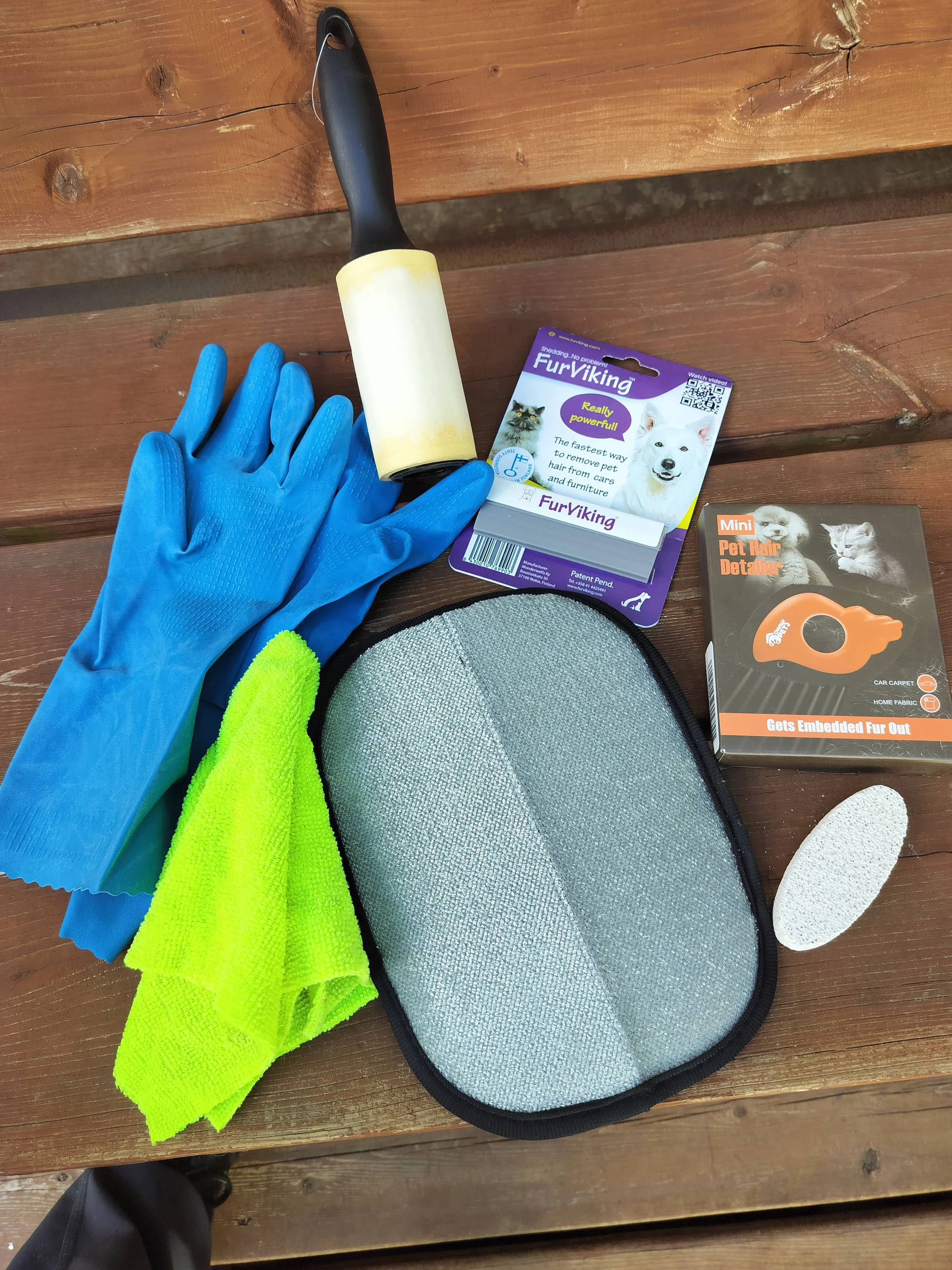 A collection of tools used to clean pet hair from vehicles
