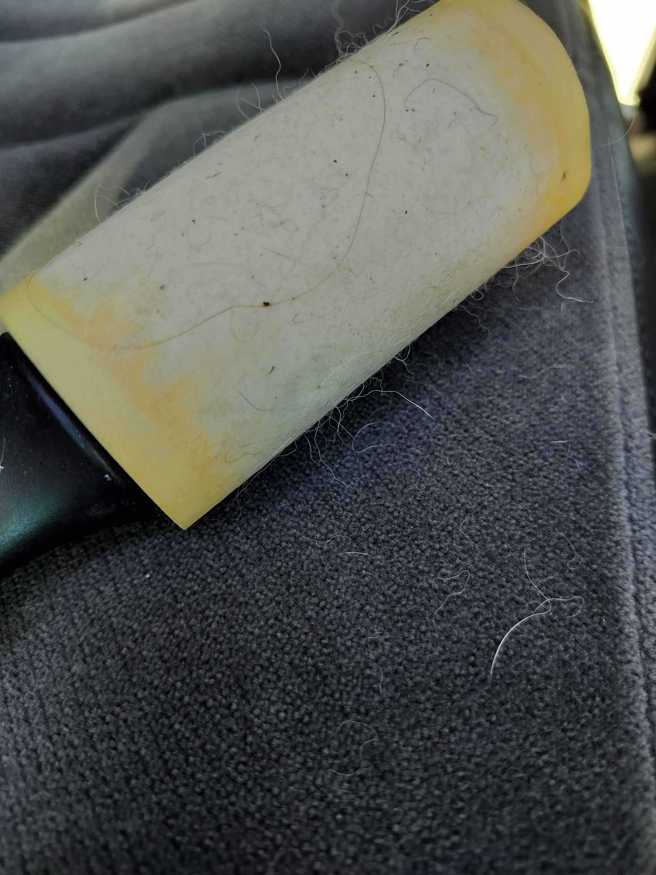 A lint roller covered with pet hair and lint