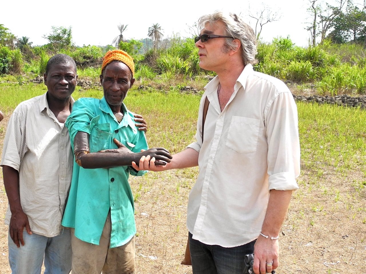 Greg Valerio meeting with a victim of the Sierra Leone diamond wars in Kono District.