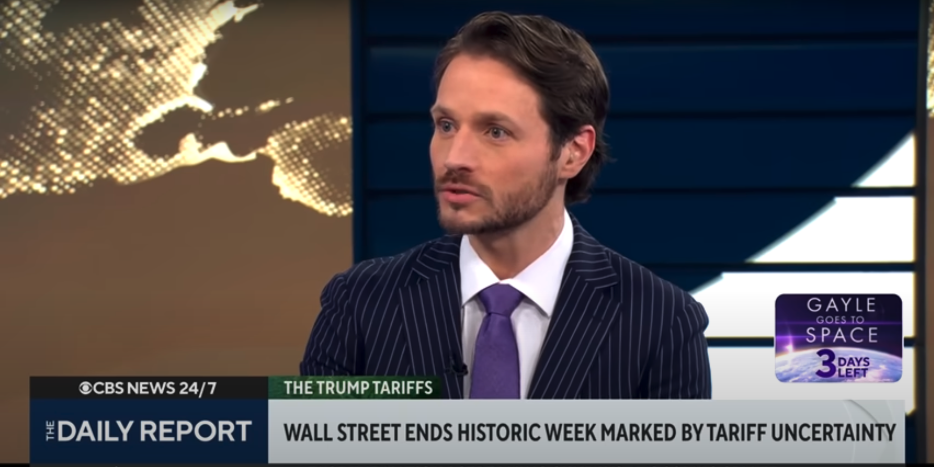 Television news broadcast featuring a man in a pinstripe suit and purple tie, with graphics of the globe and a world map in the background, discussing Wall Street ending a week marked by tariff uncertainty, on CBS News 24/7, The Daily Report segment.