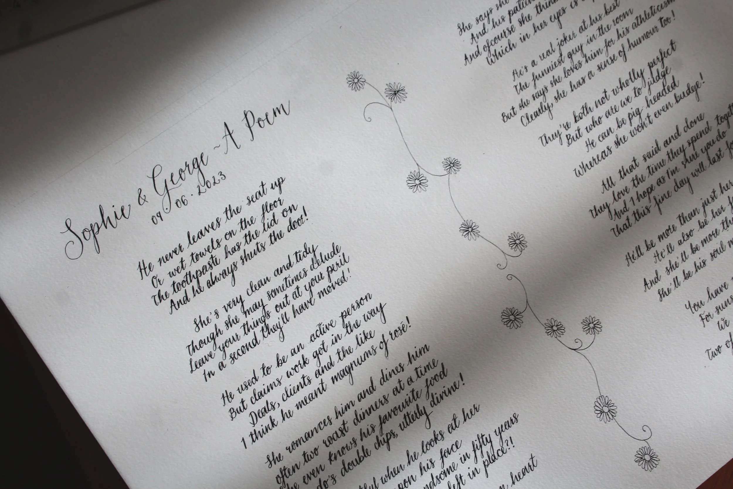 Close-up of a handwritten poem titled 'Sophie & George - A Poet' with decorative daisies drawn along the right side.